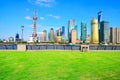 Landscape grass prospects the Shanghai Lujiazui city buildings