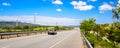 Landscape green fields blue sky highway with clouds Royalty Free Stock Photo
