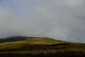 Landscape of green Irish mountain bogland on a cloudy day