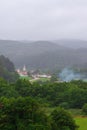 Landscape of a green valley with a small town, a cloudy summer day, in Ruiloba, Cantabria, Europe,