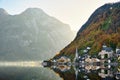 The landscape of Hallstatt, Austria, a riverside village reflecting the calm waters. The shadows in the water look like a mirror