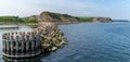 Harbor jetty and beautiful green seaside cliffs on the shores of the North Sea