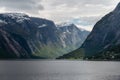 Landscape of Hardangerfjord with cloudy sky.