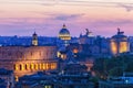 Night view at St. Peter\'s cathedral in Rome with Coliseum and Fatherland monument.