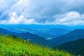 Landscape from height to mountain slopes, blue distance, meadow