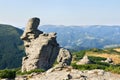 Landscape of high mountains with huge stones on top of the hillside and hills with cloudy sky. Carpathian mountains in summer Royalty Free Stock Photo