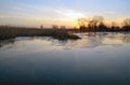 Landscape high water on river bank at sunset