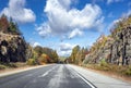 Landscape with a highway and picturesque autumn maple trees on roadside cliffs in Vermont Royalty Free Stock Photo