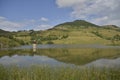 Landscape with hill reflected in the lake at Rosia