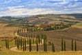 Landscape of hills, country road, cypresses trees and rural houses,Tuscany Royalty Free Stock Photo