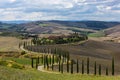 Landscape of hills, country road, cypresses trees and rural houses,Tuscany Royalty Free Stock Photo