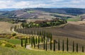 Landscape of hills, country road, cypresses trees and rural houses,Tuscany Royalty Free Stock Photo