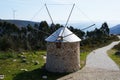 Rustic windmill on top of mountain