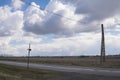 landscape with holy cross and power line pole