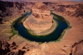 Landscape of Horseshoe Bend with sunrise and reflecting surface of Colorado River near Grand Canyon. Royalty Free Stock Photo