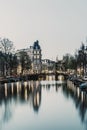 Landscape with houses and canal in Amsterdam Royalty Free Stock Photo