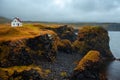 Landscape of Iceland, lonely house on the ocean, fog and rain. A journey into a far country Royalty Free Stock Photo