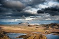 Landscape in Iceland with Stormy Clouds in the Sky, Road and Mountain. Royalty Free Stock Photo