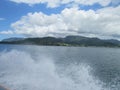 Landscape of Ilhabela island and the Atlantic ocean seen from the sea, SP state, Brazil.