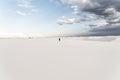 Man walking at White Sands National Monument in Alamogordo, New Mexico.