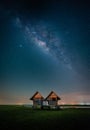 Landscape image of milky way over the abandoned twin house near Chalerm Phra Kiat road in Thale Noi, Phatthalung, Thailand Royalty Free Stock Photo