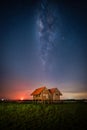Landscape image of milky way over the abandoned twin house near Chalerm Phra Kiat road in Thale Noi, Phatthalung, Thailand Royalty Free Stock Photo