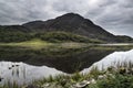 Landscape image of mountain reflected in still lake on Summer mo Royalty Free Stock Photo