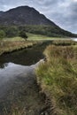 Landscape image of mountain reflected in still lake on Summer mo Royalty Free Stock Photo