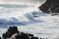 Landscape image of Ocean Waves Crashing against Coastal Rocks