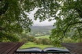 Landscape image of view from Precipice Walk in Snowdonia overlooking Barmouth and Coed-y-Brenin forest coming out of pages in Royalty Free Stock Photo