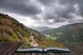 Landscape image of view from Precipice Walk in Snowdonia overlooking Barmouth and Coed-y-Brenin forest coming out of pages in Royalty Free Stock Photo