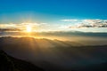 Landscape images of The morning sun, where a beautiful beam of light covers the mountain range Royalty Free Stock Photo