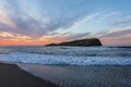 Landscape of an island in Mediterranean sea at sunset between clouds and a pure blue sky, an ideal place for a summer vacation, wa Royalty Free Stock Photo