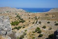 View of Navarone Bay and surrounding area in August. Lindos, Rhodes island, Greece Royalty Free Stock Photo