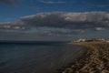 Landscape of italian sea. Fishermans Boats on the beach. Blue cloudy sky at sunset Royalty Free Stock Photo