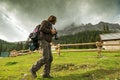 Landscape Italy, Dolomites - Men photographer hiking at the shelter house