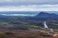 Landscape of Krafla area in northern Iceland with Kroflustod geothermal power plant at right and Myvarn lake at background Royalty Free Stock Photo