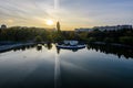 Landscape with the lake and green and yellow trees in Drumul Taberei Park, also known as Moghioros Park, in Bucharest, Romania, at