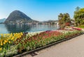 Landscape with Lake Lugano and colorful tulips in bloom from Ciani Park in springtime. Royalty Free Stock Photo