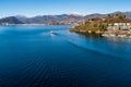 Landscape of Lake Maggiore with ferry that crosses the lake in LavenoMombello, Italy Royalty Free Stock Photo