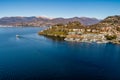 Landscape of Lake Maggiore with ferry that crosses the lake in LavenoMombello, Italy Royalty Free Stock Photo