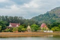 Landscape with lake, trees and temple near mountain in Phuket. Thailand.