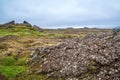 Iceland landscape with broken old lava hill and desert valley way to volcano Royalty Free Stock Photo