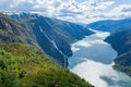 Landscape of the Langfoss waterfall and mountains in Akrafjorden, Norway Royalty Free Stock Photo