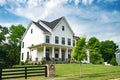 Landscape with large country house. Large mowed lawn and blue sky