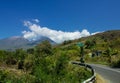 A Landscape of Lewotobi mountain, a twins volcano, street path and motorcycle from Larantuka, East Nusa Tenggara, Indonesia