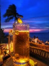 Beautiful sunset view and cold beer and vivid color on blue sky. Royalty Free Stock Photo