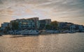 Landscape of Lincoln Brayford with buildings and boats on sea water with blue skies and sun