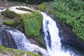 Landscape little waterfall among stones flowing