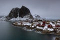 Landscape of the Lofoten Islands in Norway with traditional wooden red fisherman huts in front of the sea and this beautiful mouta Royalty Free Stock Photo